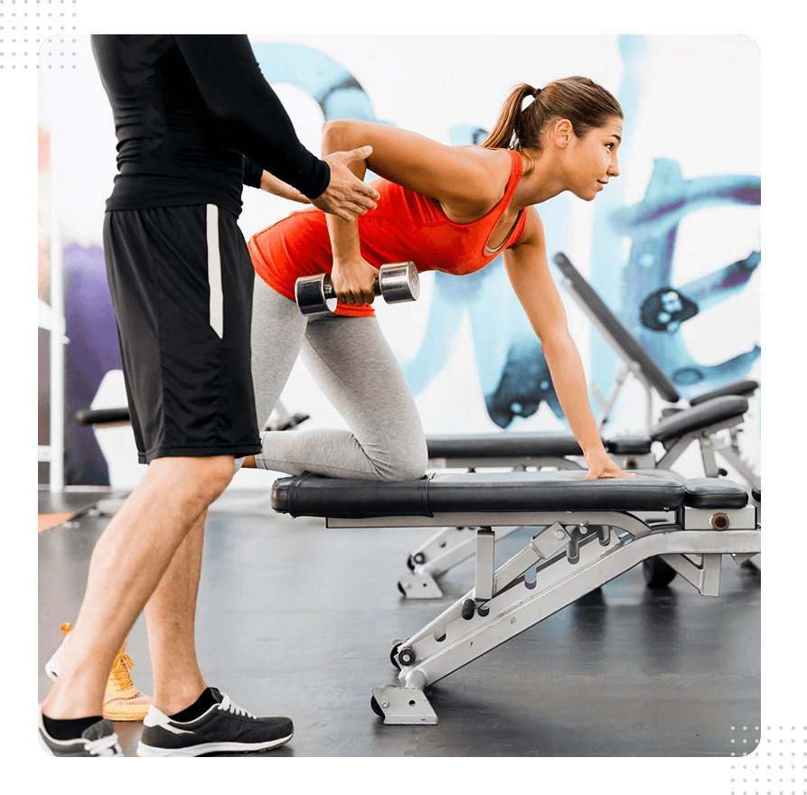 A woman is working out in the gym