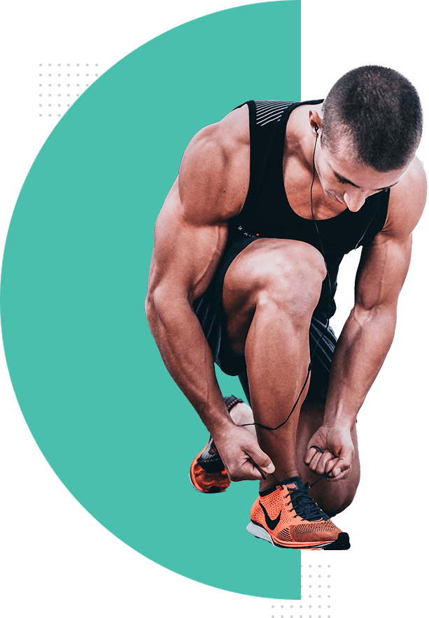 Man tying his shoelaces before a run.