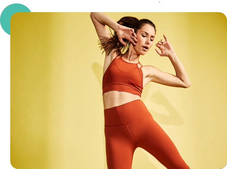 Woman in red yoga outfit posing